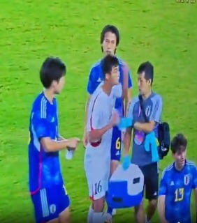 North Korean players try to attack the referee after their 1 - 2 defeat to Japan in the Asian Games Quarterfinals
