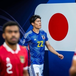 Takehiro Tomiyasu walking out ahead of Japans game against Indonesia